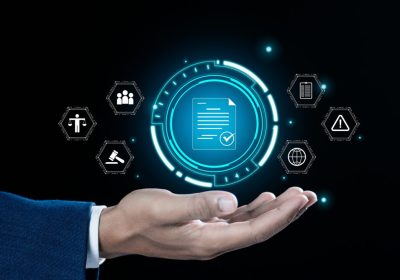 Compliance rules and law regulation policy concept. Businessman hand holding compliance icons on virtual screen for enforcement of laws, regulations, and standards.